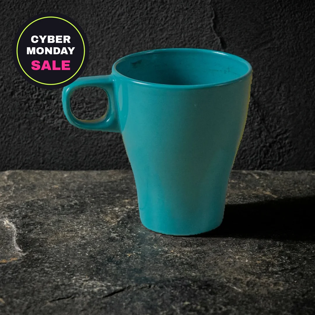 Teal mug on dark stone with a Cyber Monday sale badge in the corner