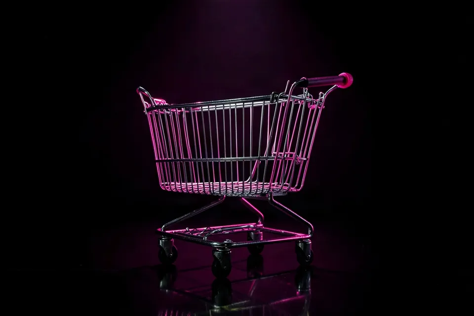 Empty shopping cart under a spotlight for a Black Friday sale photo