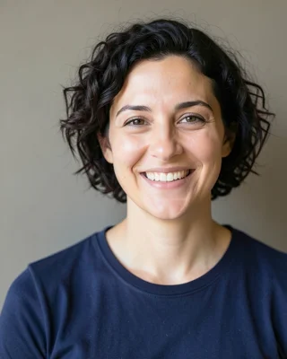 Original photo for the Cosmic Princess example: woman with short curly hair in a navy T-shirt