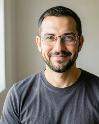 Original photo for the Halloween Robot example: man with glasses and a beard in a grey T-shirt