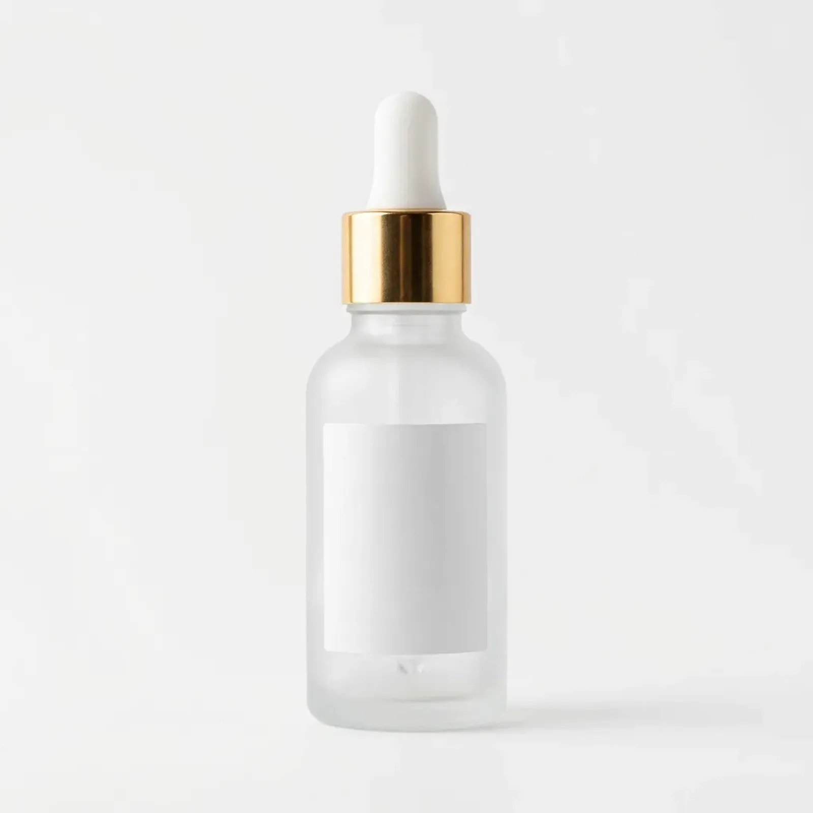 before: original product photo of a frosted dropper serum bottle with a gold collar