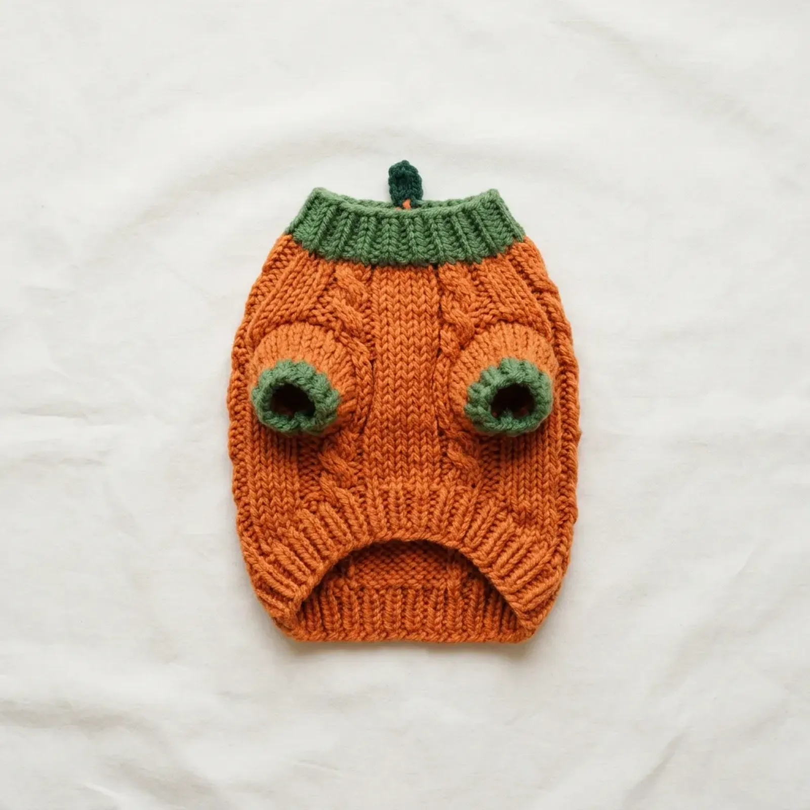 before: original product photo of an orange knit pumpkin pet sweater with green collar