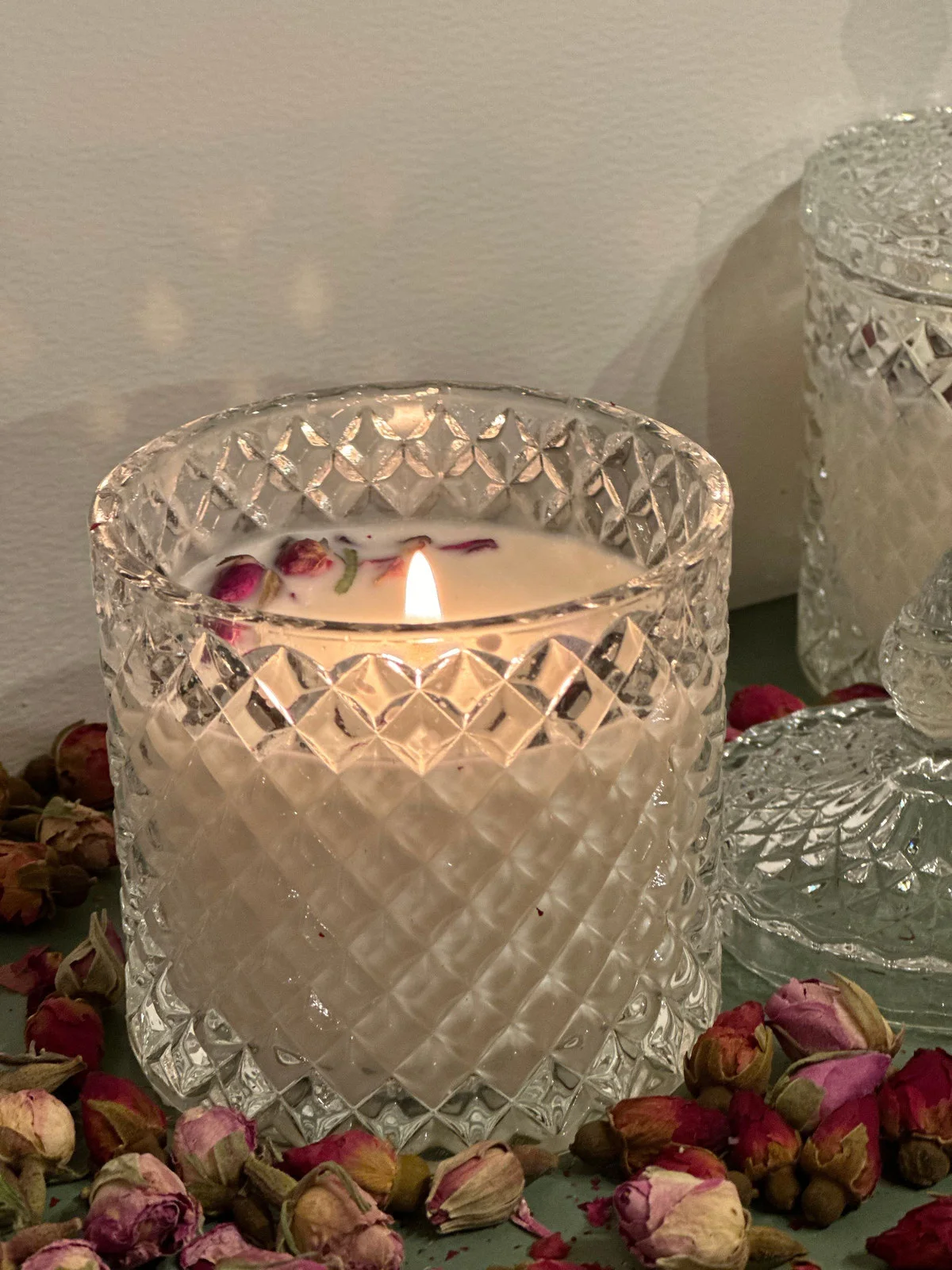 before: original glass candle in warm low light