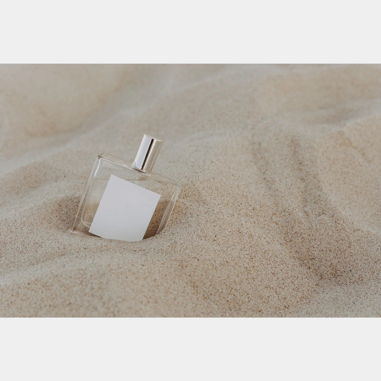 before: original unbranded perfume bottle in pink directional light