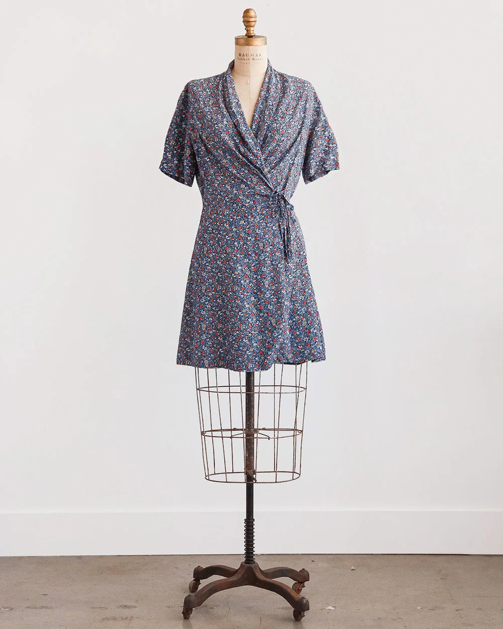 before: an unbranded patterned dress photographed as a flat lay