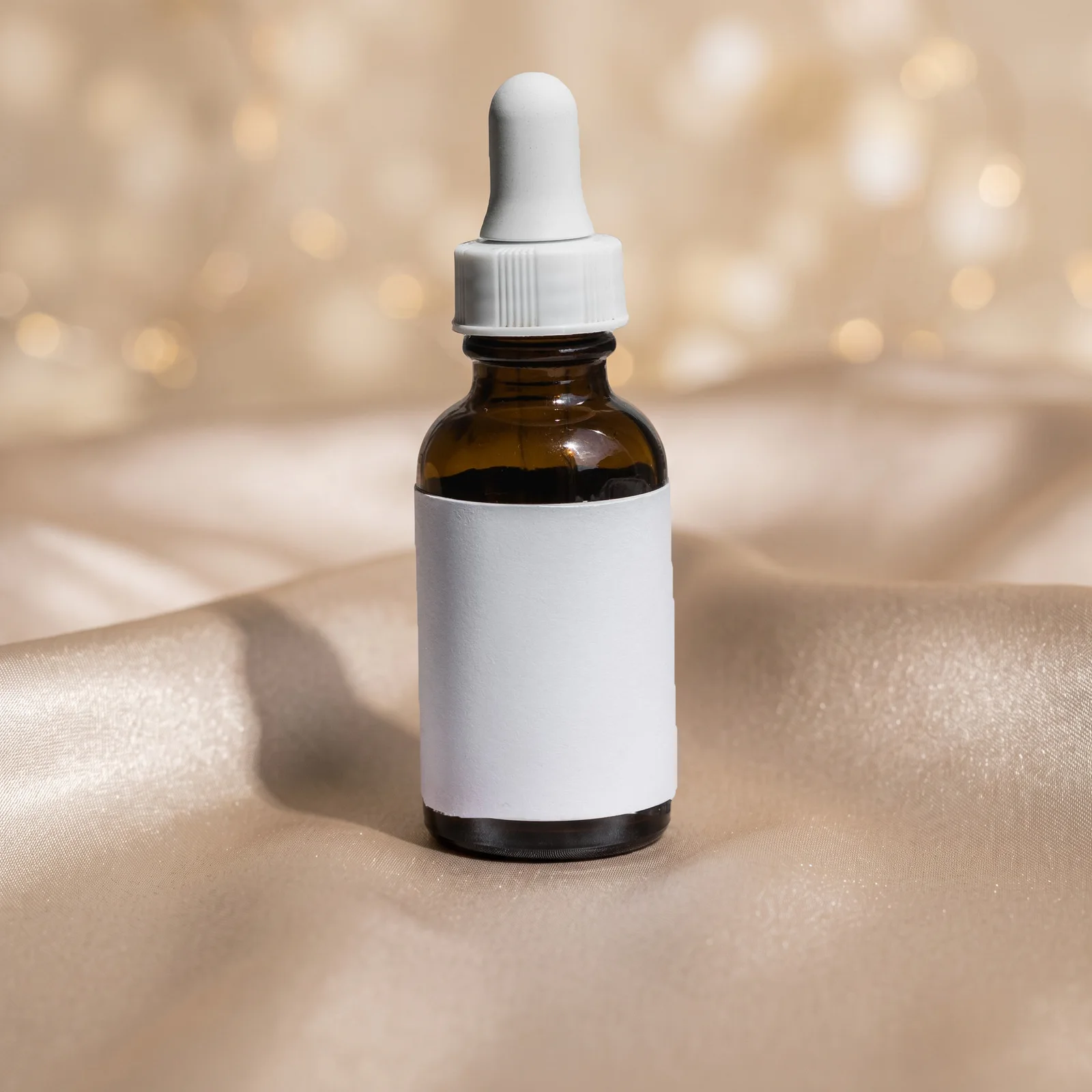 unbranded skincare bottle in warm festive light