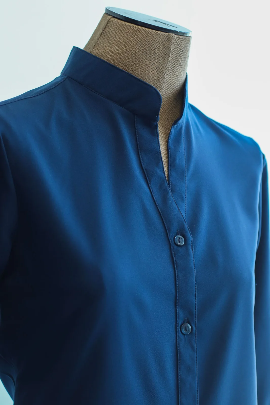 before: blue shirt collar on a visible mannequin