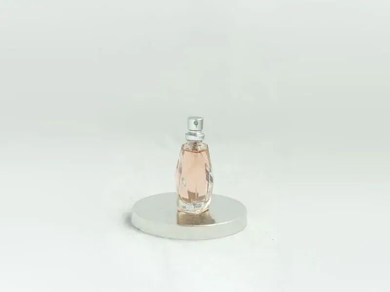 Original perfume bottle photo on a plain background