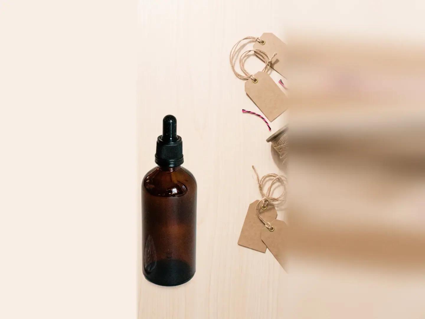 Serum bottle beside blank paper sale tags in a Black Friday scene