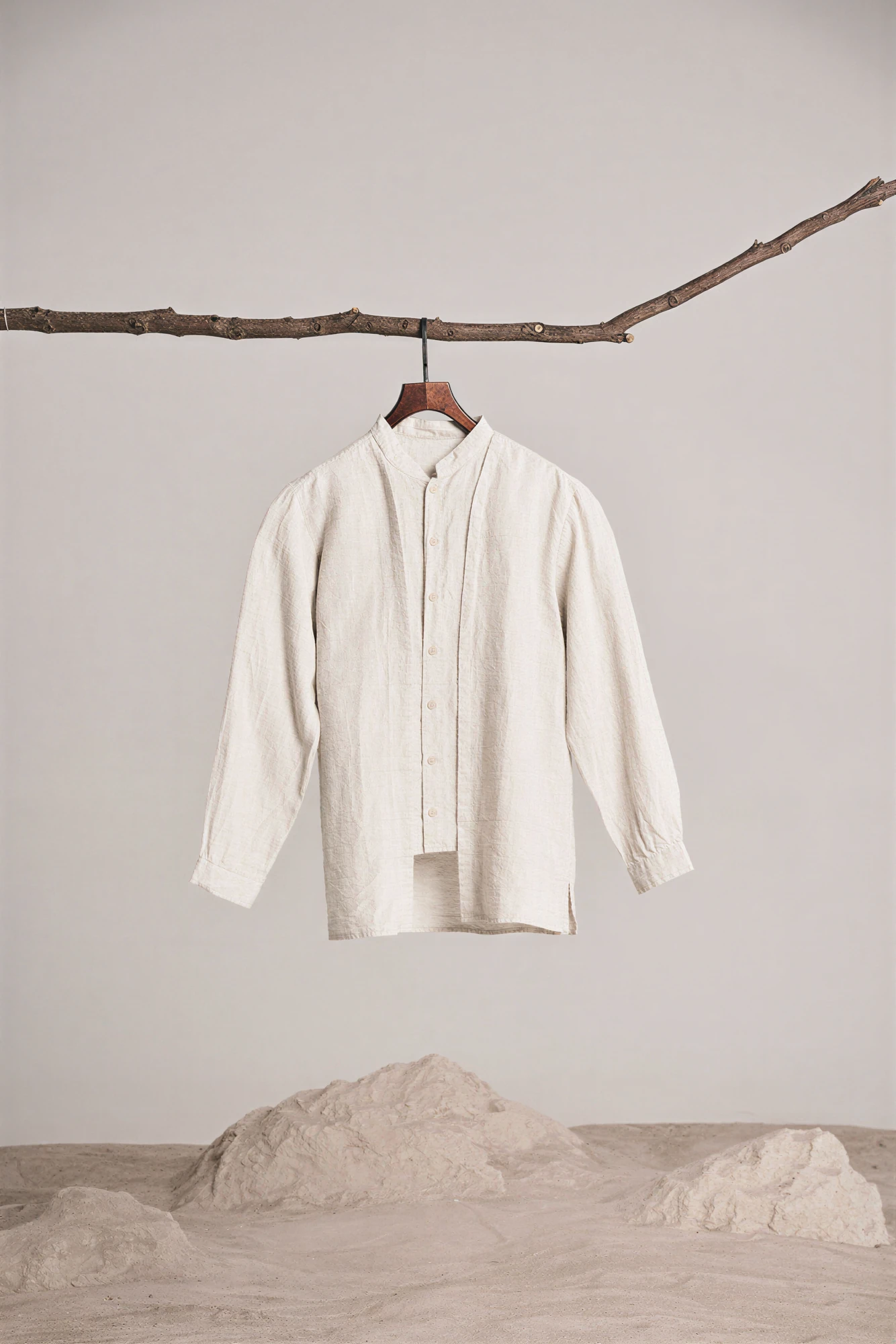 after: detail crop of the upscaled shirt photo around the buttons