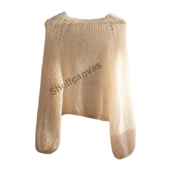 Light cream mohair sweater on a white background, with fine pale fibers around its sleeves and hem and a Shelfcanvas watermark